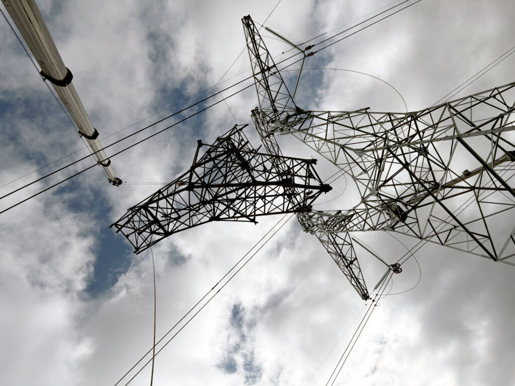 Overhead electric power transmission lines and towers